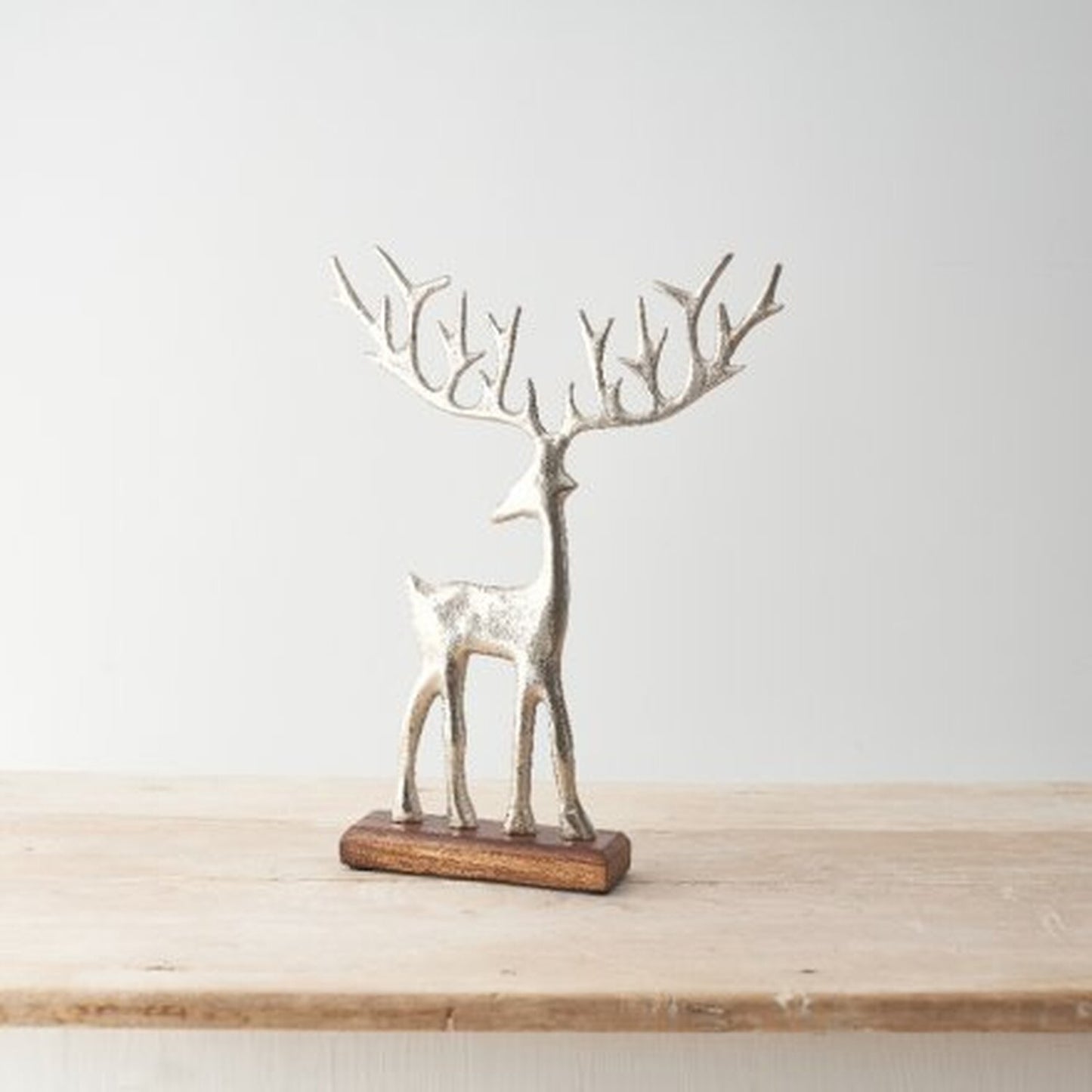 Reindeer on a Solid Wooden Base - Silver