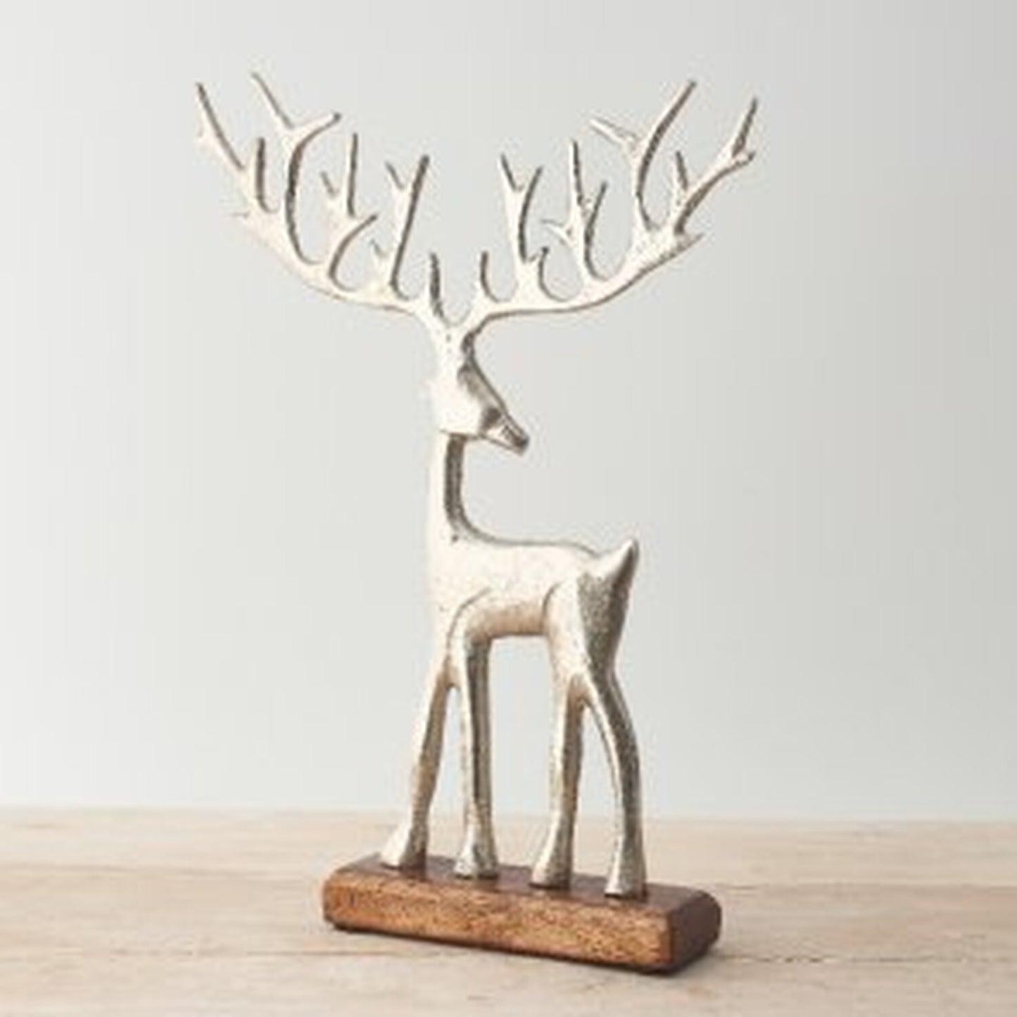 Reindeer on a Solid Wooden Base - Silver