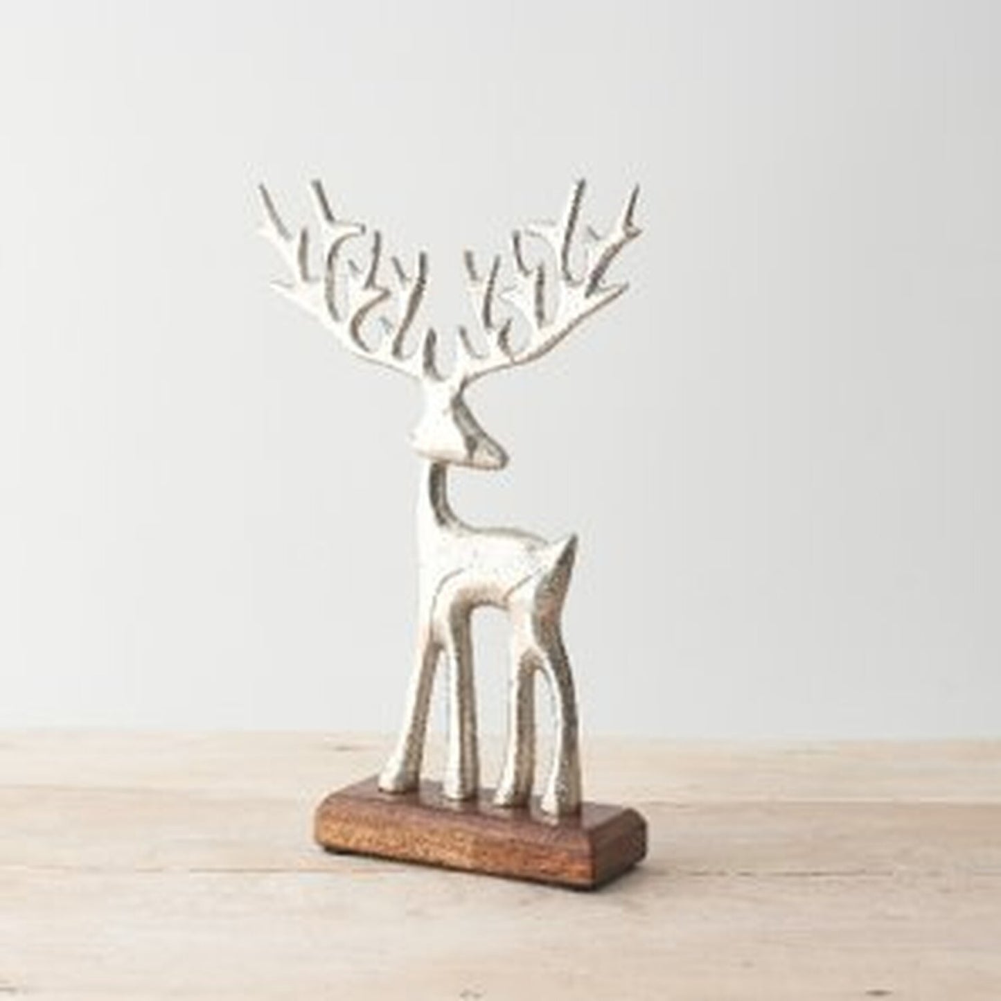 Reindeer on a Solid Wooden Base - Silver